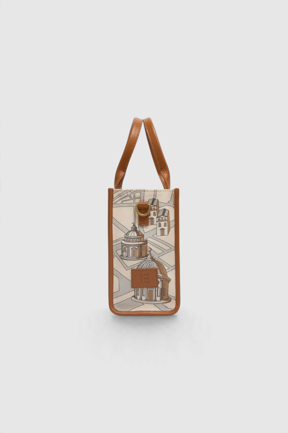 The Copper Shed Caprice Bag in Rome print with cotton body, brown leather handles, and trim on a light background.