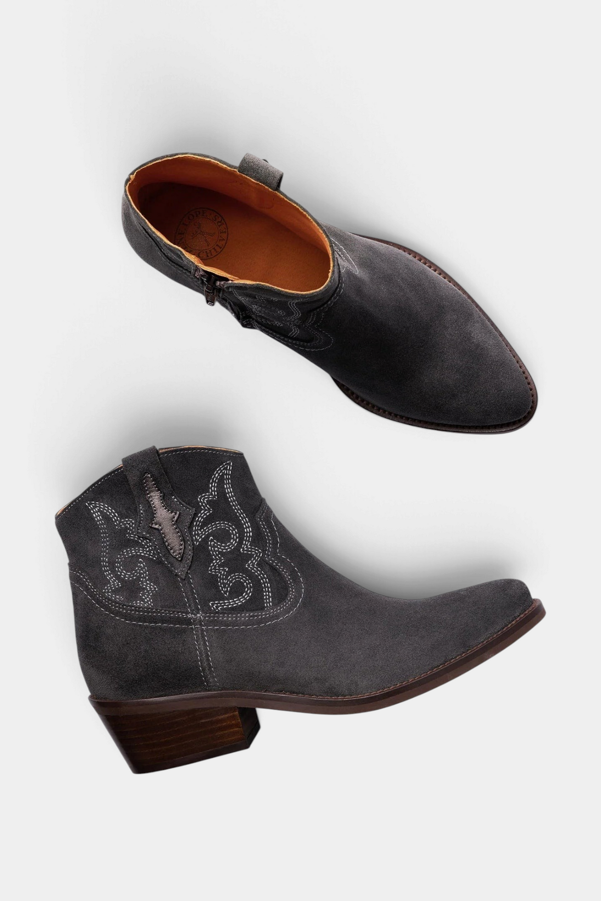 The Copper Shed Cassidy suede ankle boots in charcoal grey with western hand-stitched detailing and a low Cuban heel.