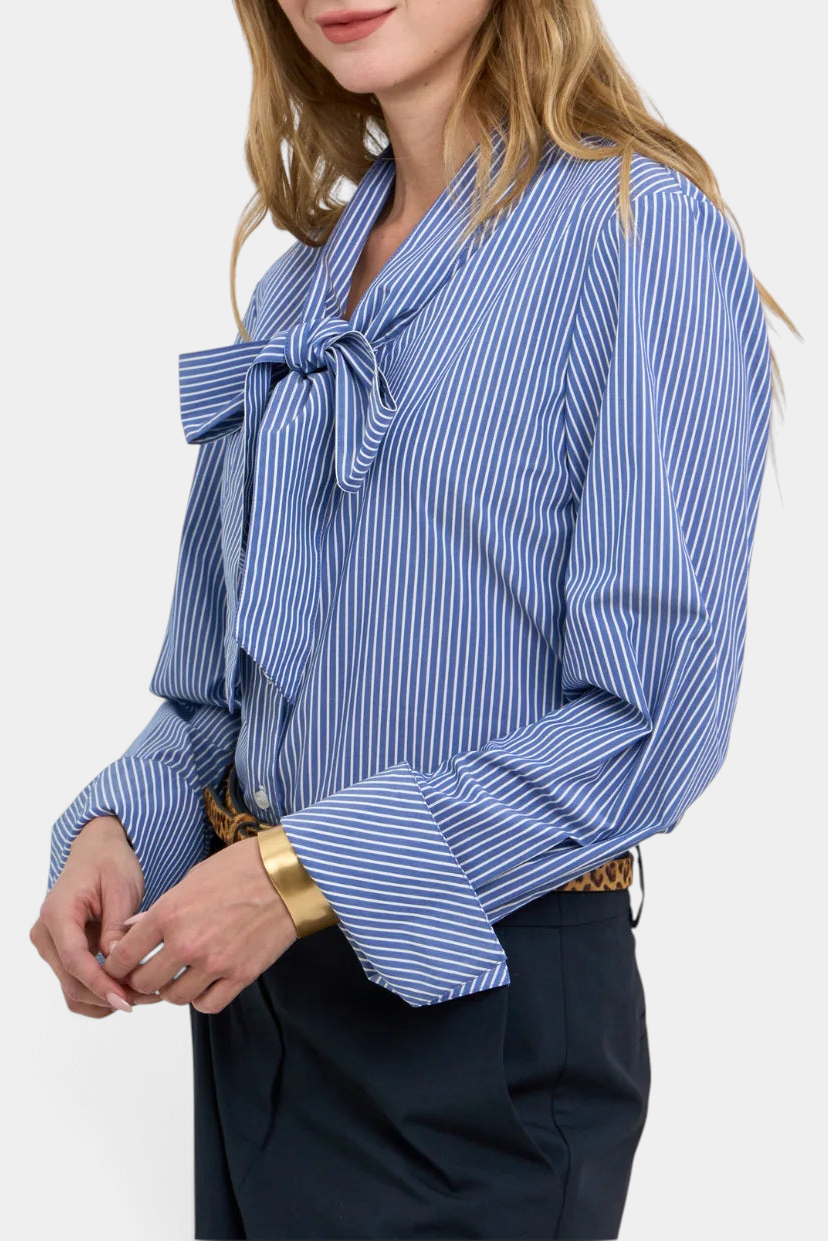 The Copper Shed Cassie bow blouse in blue and white stripe cotton with long sleeves and double button cuffs