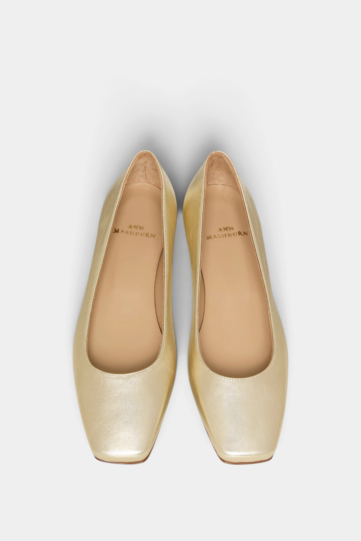 The Copper Shed Cecelia demi-flat in metallic gold Italian lambskin with a cushioned insole and square toe design.