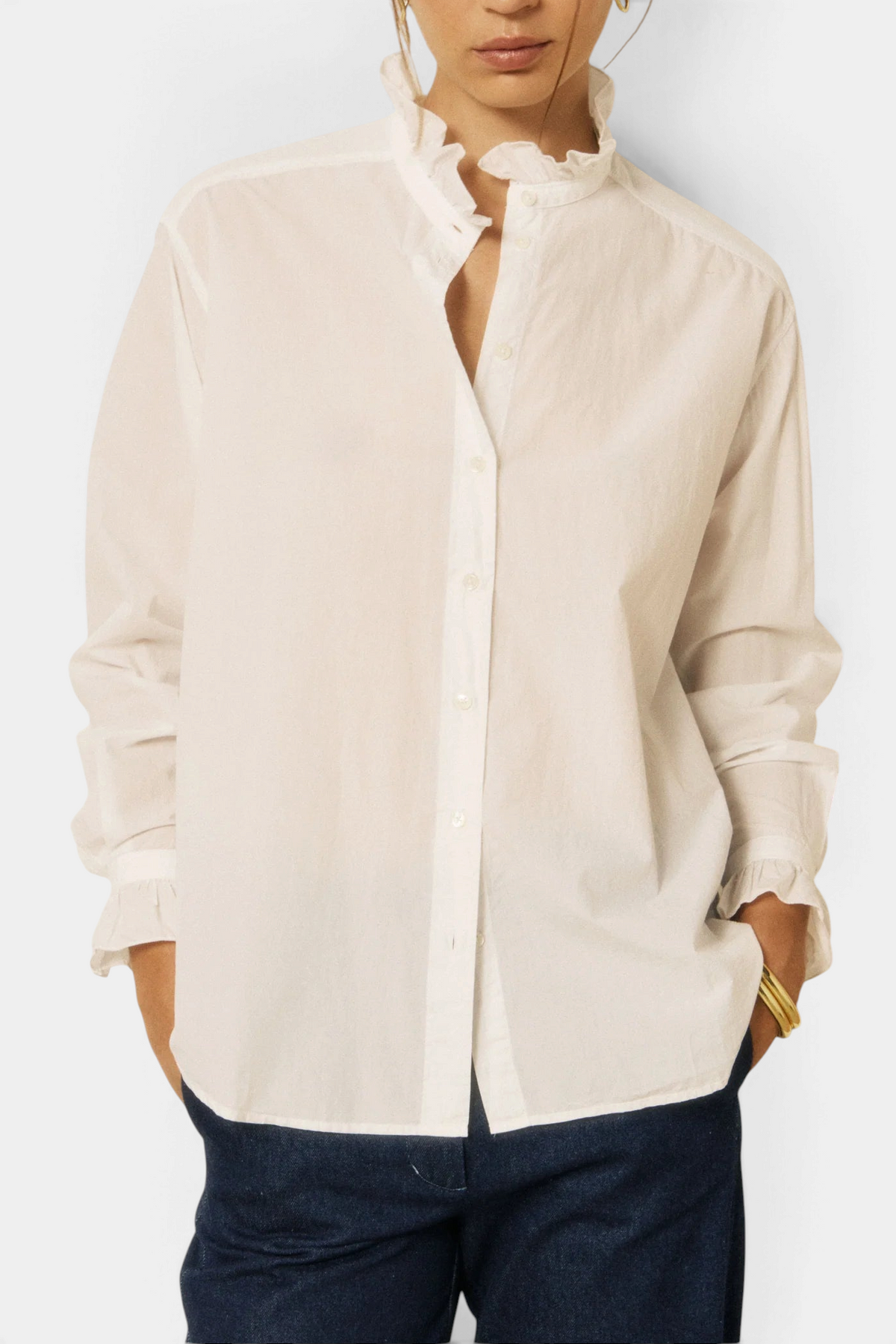 The Copper Shed Chana white cotton poplin shirt featuring a ruffled stand-up collar and gathered ruffled cuffs.