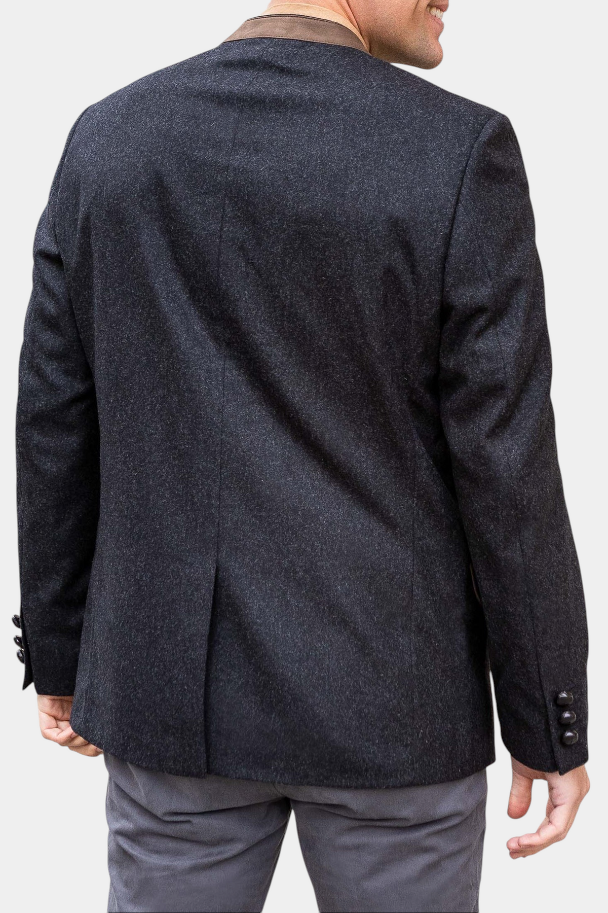 The Copper Shed Edward classic Austrian jacket in charcoal wool with a brown suede mandarin collar, back view.