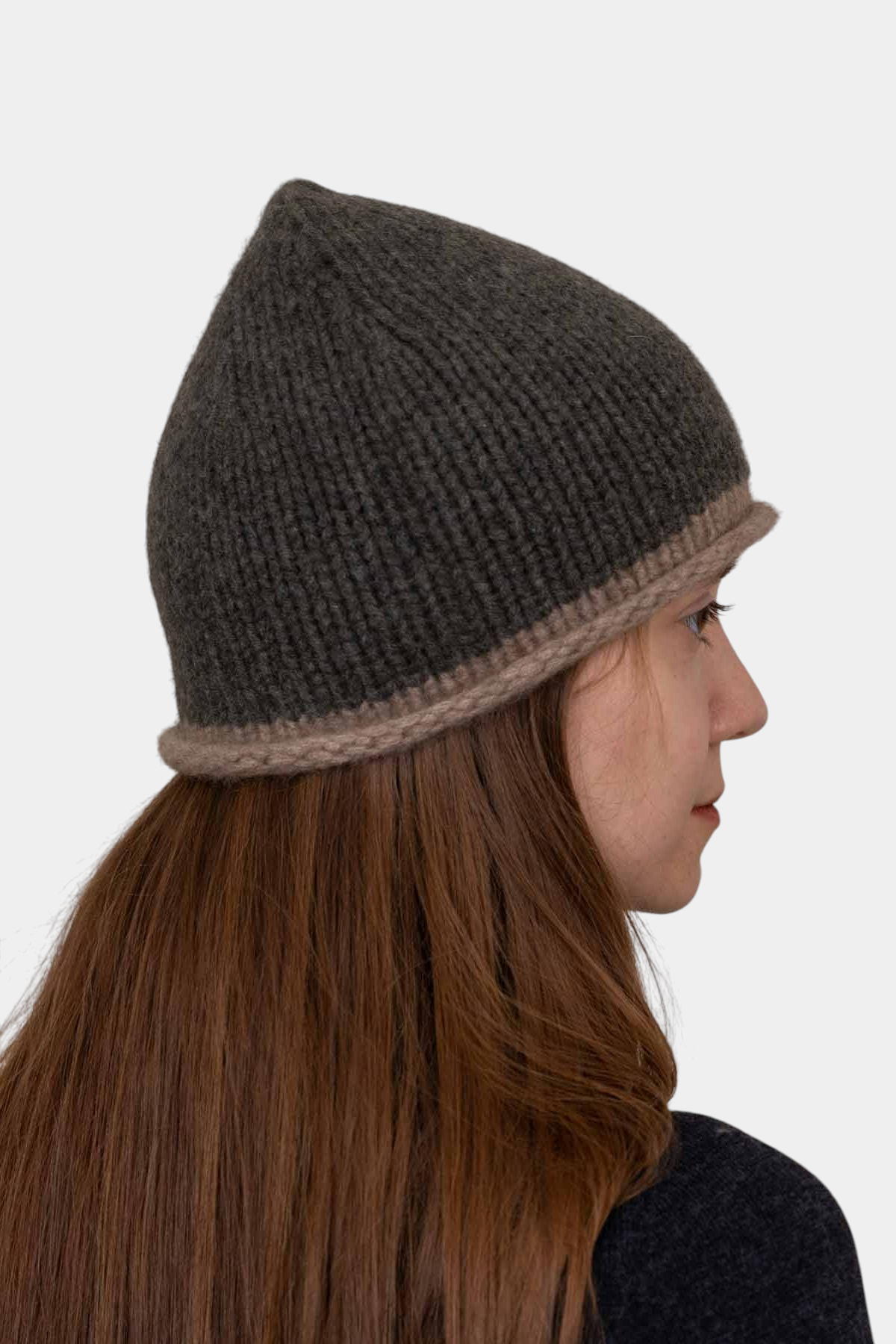 The Copper Shed Cottage hand-knitted beanie in dark grey organic cashmere with a relaxed rolled edge profile.