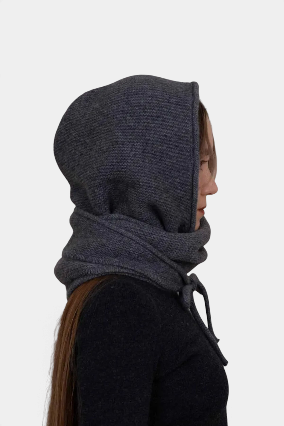 The Copper Shed charcoal grey organic cashmere hooded scarf worn by a woman, showing a side profile view.