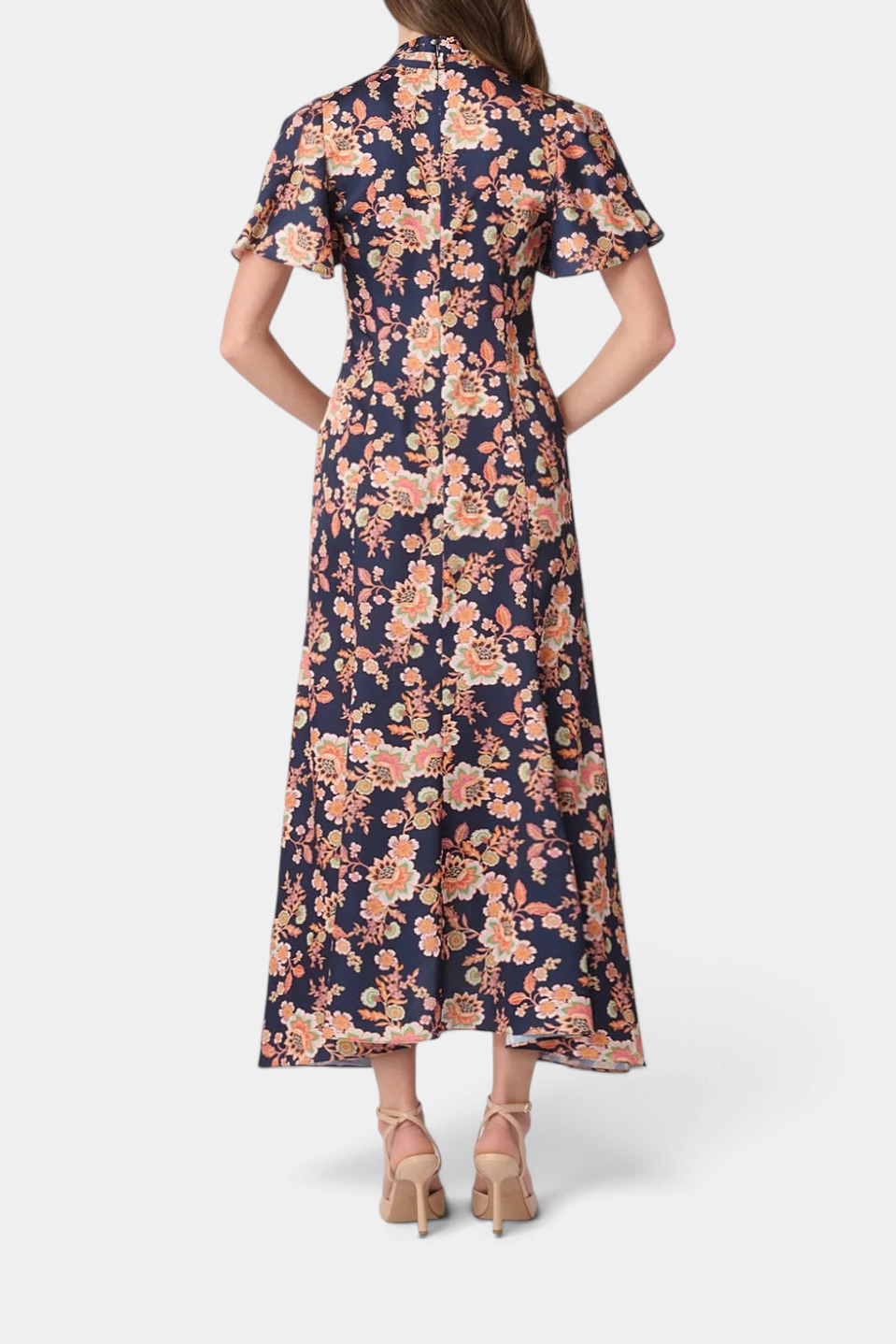 Back view of The Copper Shed Cinnie midi dress in navy floral satin with flutter sleeves and asymmetric hem