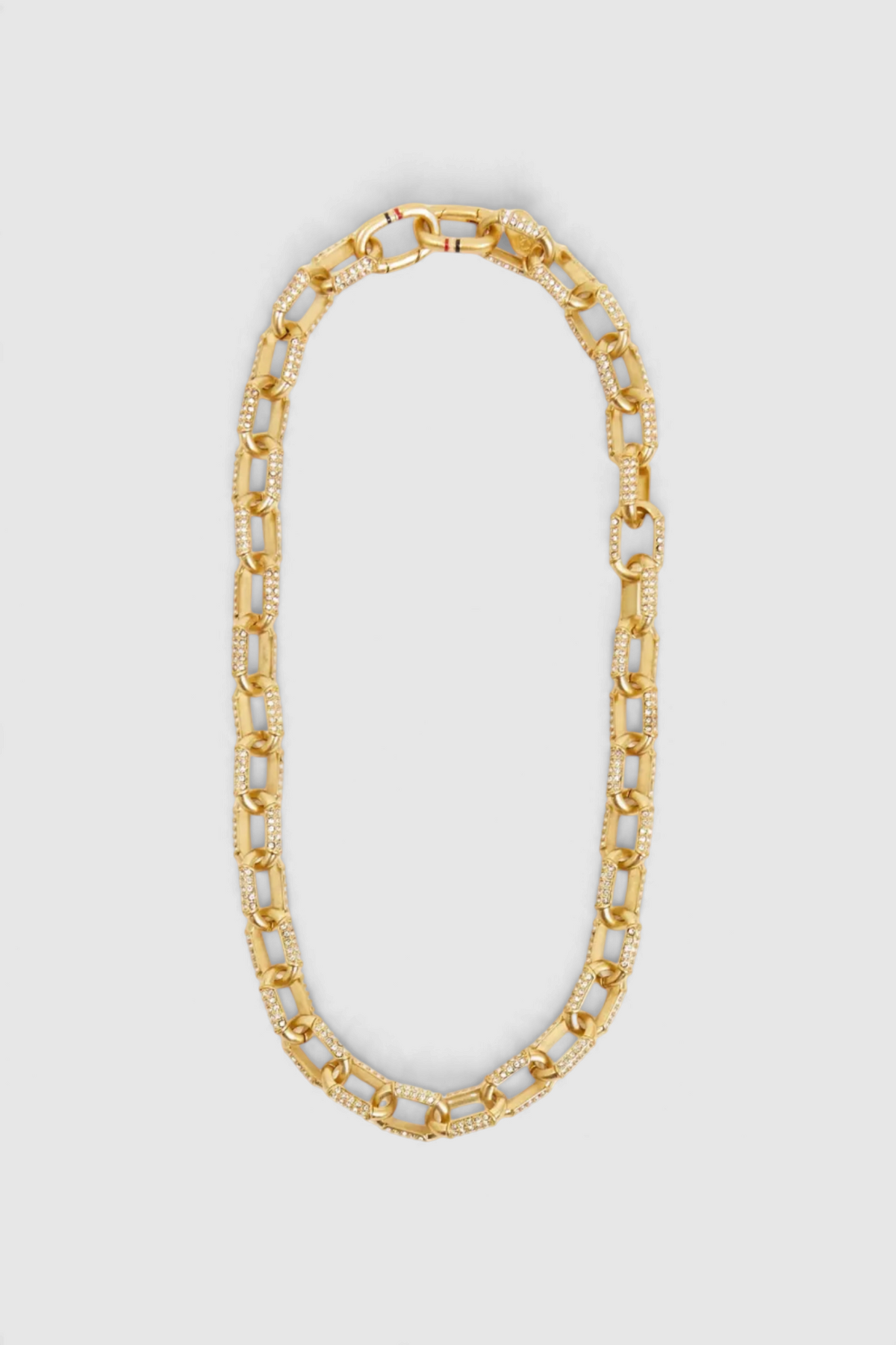 The Copper Shed Clare V Le Link gold chain necklace featuring sparkling crystal embellishments on each link.