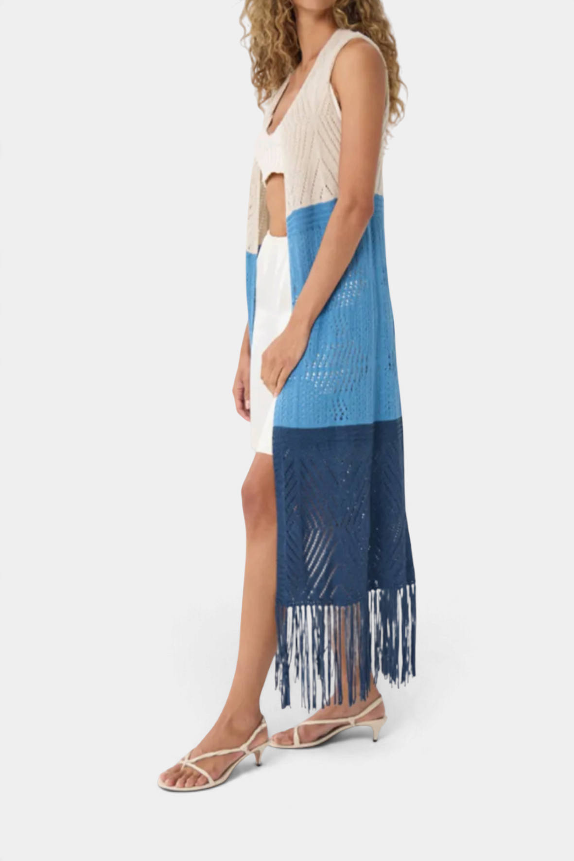 The Copper Shed color block pointelle maxi vest in cream, blue, and navy with fringe hem worn by a model