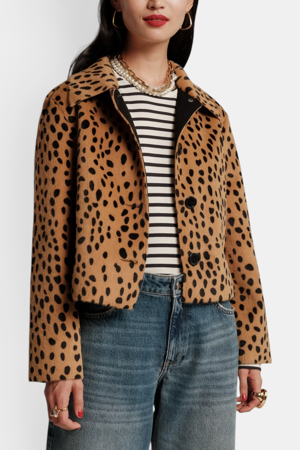 The Copper Shed Cosette cropped faux fur jacket in a tan and black leopard print with a button-front closure.