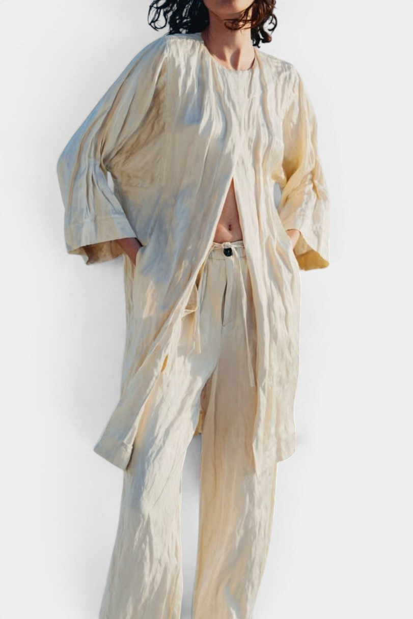 The Copper Shed crinkle viscose satin coat in cream, featuring a relaxed open front design and metallic blend fabric.