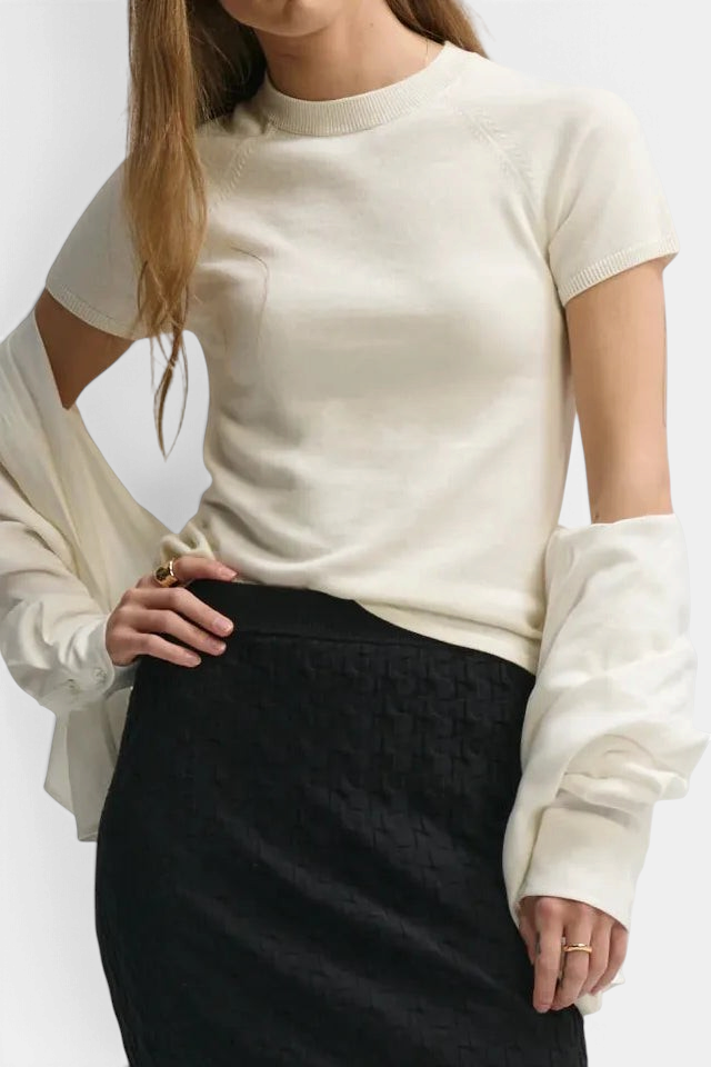 The Copper Shed cream cotton-silk blend raglan baby tee with ribbed crew neck and short sleeves on a model