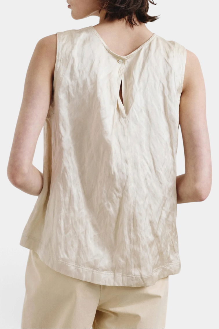 The Copper Shed sleeveless crinkled viscose satin top in champagne with a back button closure, back view.