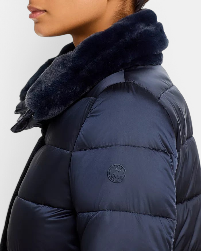 The Copper Shed Dalea puffer coat in navy blue with channel quilting and a soft faux-fur stand collar.