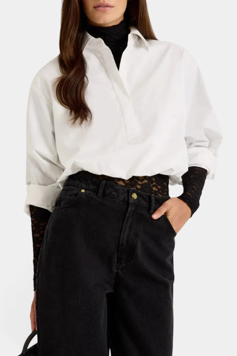 The Copper Shed Dallas Top in white cotton with a cropped silhouette, bubble hem, and adjustable sleeves.