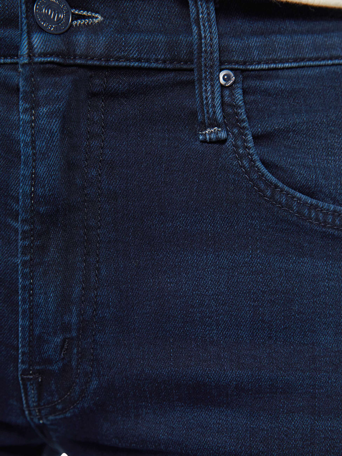The Copper Shed dark blue stretch denim jeans featuring a mid-rise fit with a zip fly and subtle whiskering detail.