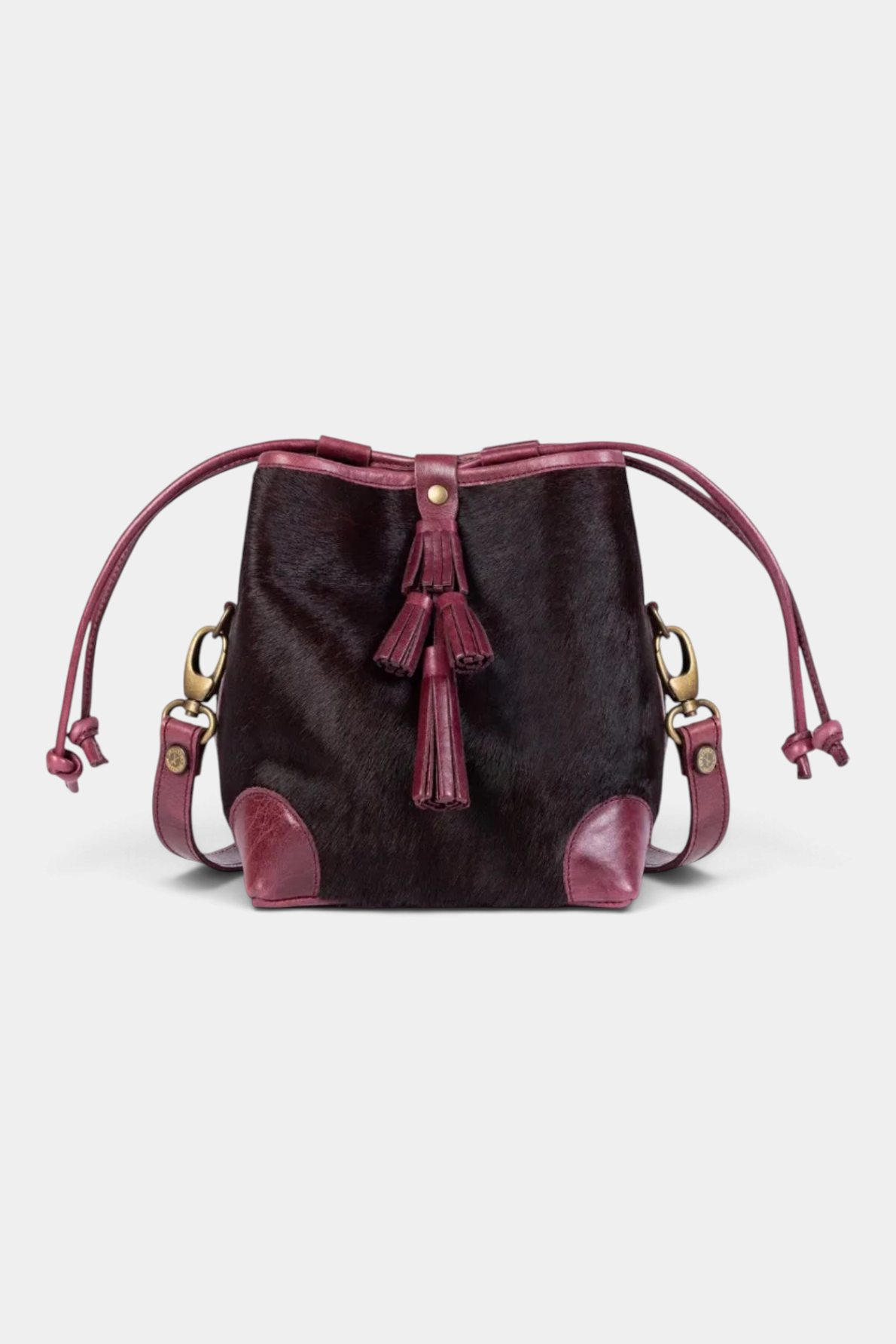 The Copper Shed dark cherry pony cowhide Fortune Teller bag with leather trim, tiered tassel, and crossbody strap.
