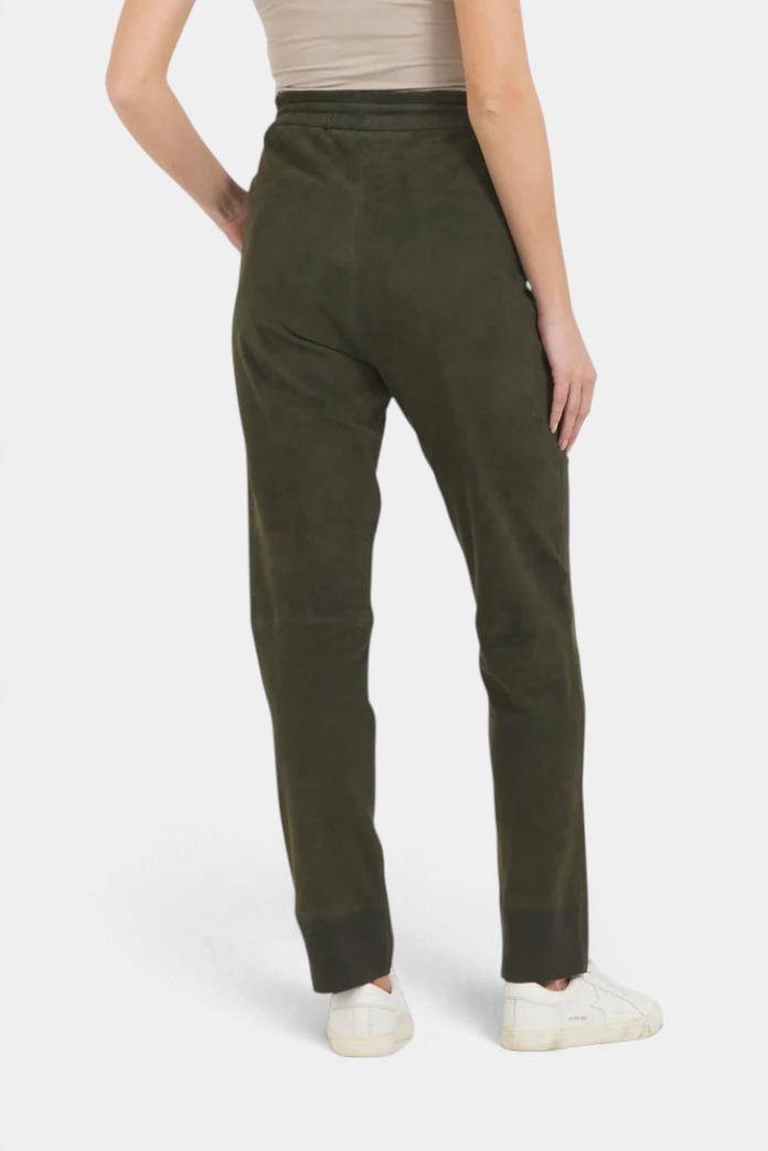 The Copper Shed Kyle jogger pants in dark olive suede with an elastic waistband, shown from the back view.