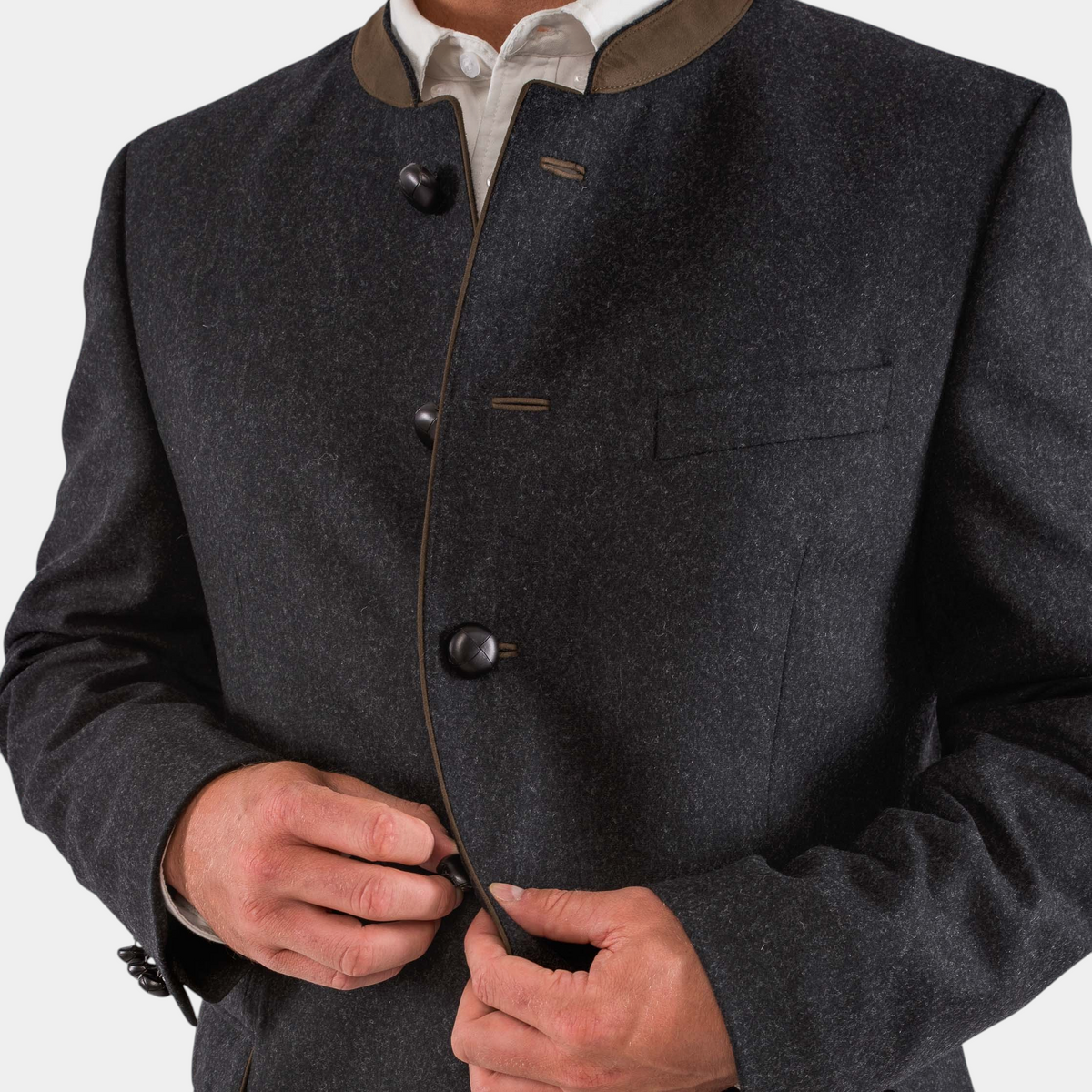 The Copper Shed Edward classic Austrian jacket in charcoal wool with a brown suede mandarin collar and leather buttons.