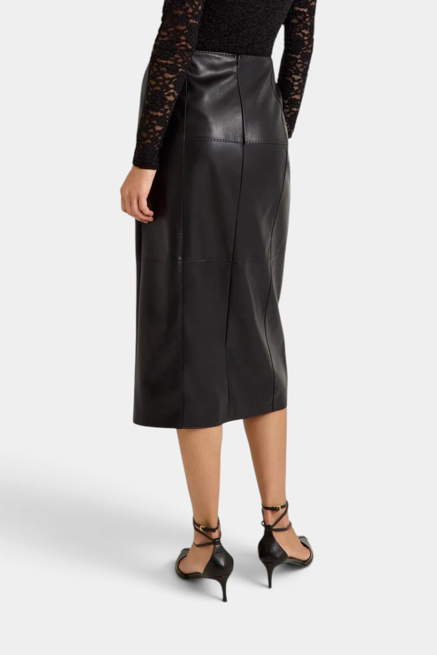 The Copper Shed Elliott midi pencil skirt in black vegan leather with visible pick stitching, back view.
