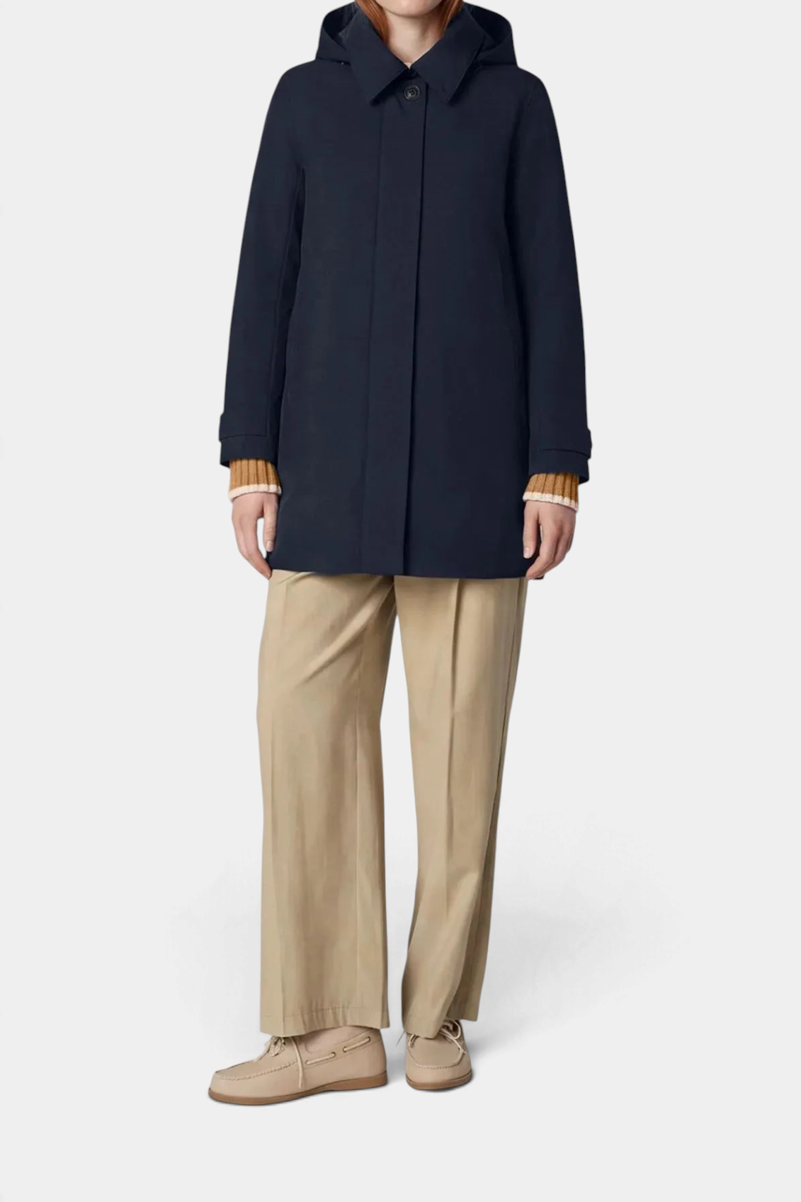The Copper Shed Embie navy blue mid-length waterproof raincoat with a detachable hood and faux horn buttons.