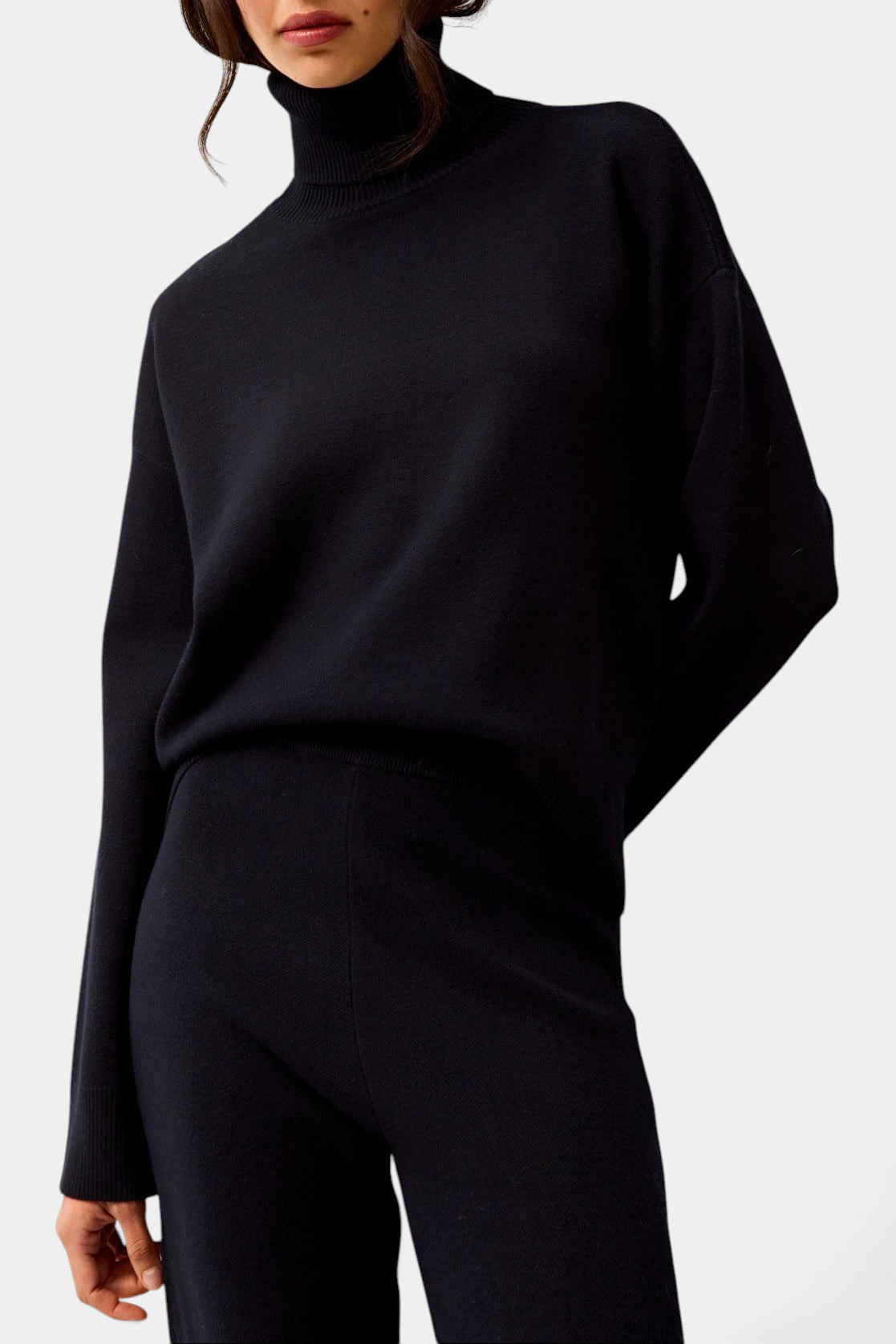 The Copper Shed Emmy sweater in deep navy featuring a mock neck and relaxed boxy fit in a structured knit fabric.