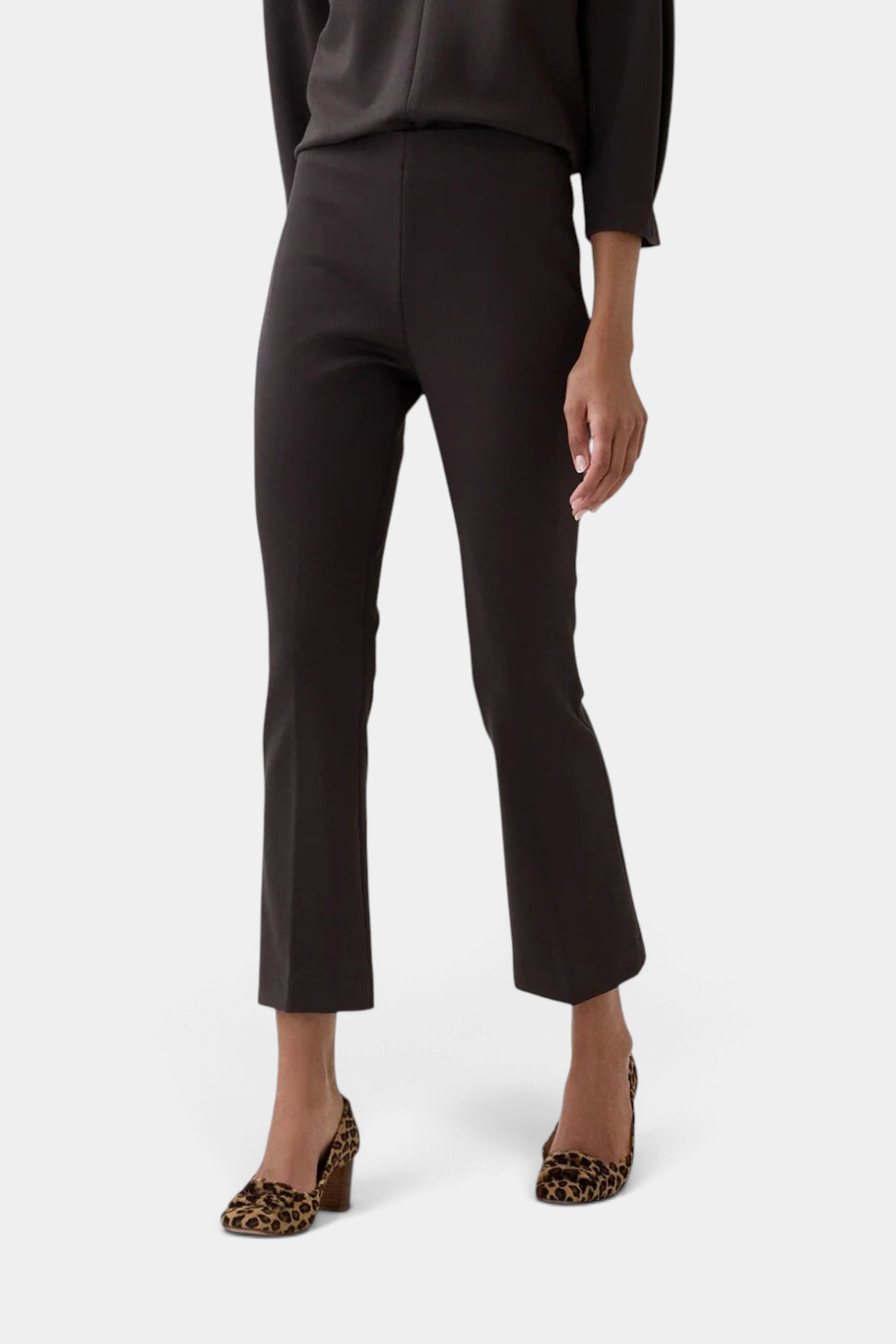 The Copper Shed Faye Flare Cropped Pant in dark brown tricotine with a clean elastic waist and flared leg silhouette.