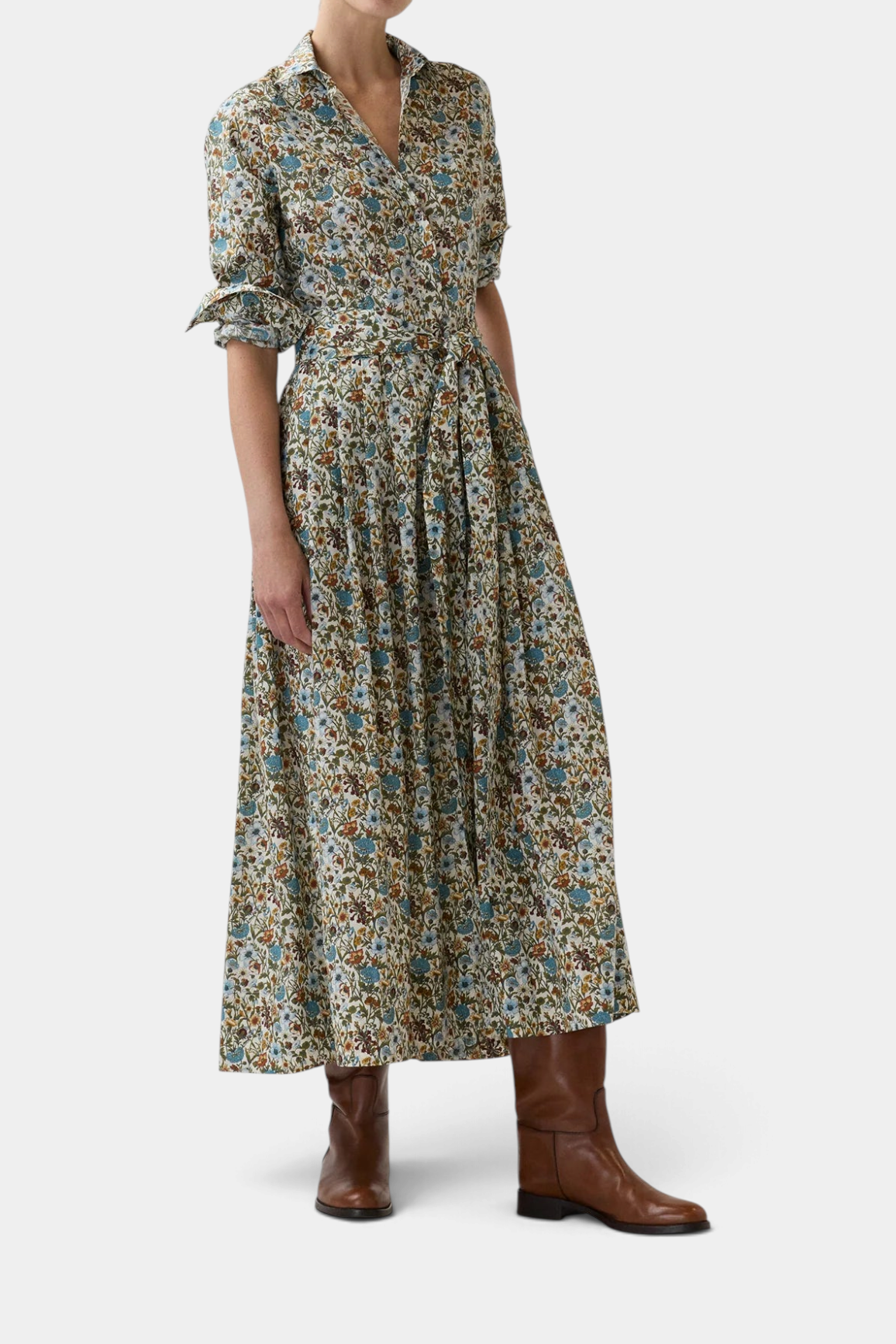The Copper Shed floral print cotton shirtwaist maxi dress with a belted waist and pleated skirt on a model.