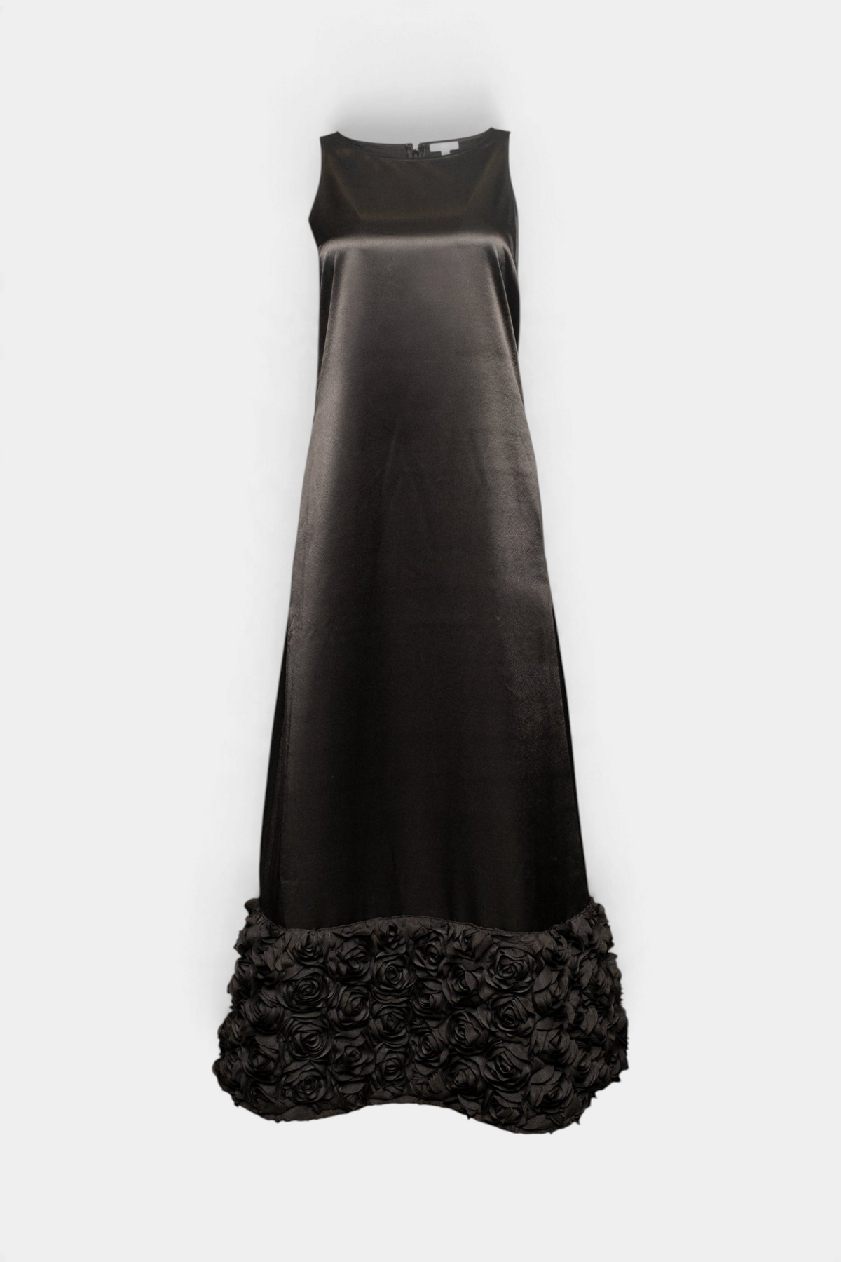 The Copper Shed Francesca black maxi dress in dutch satin featuring a sleeveless cut and floral applique hem detail.