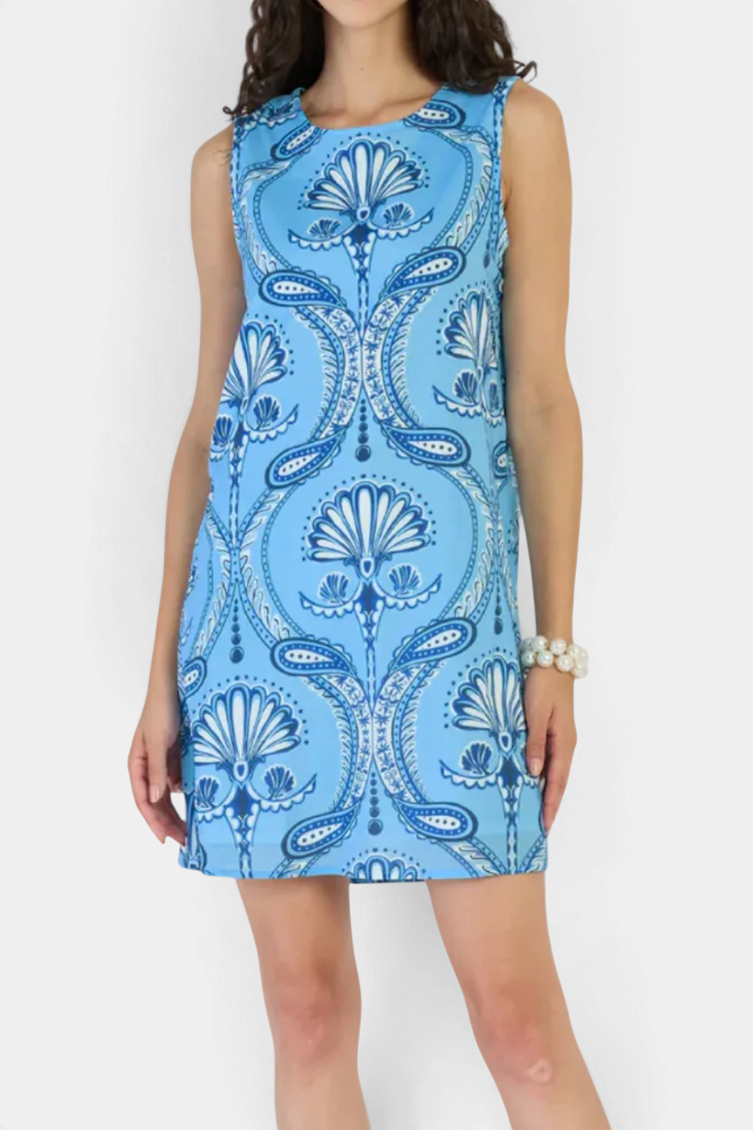 The Copper Shed Frankie mini dress in blue cotton-linen blend with a 1960s-inspired paisley print and shift silhouette