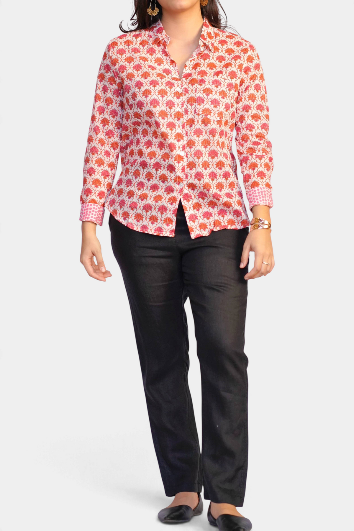 The Copper Shed Frannie long sleeve cotton shirt with orange floral block print and contrasting cuffs on a model
