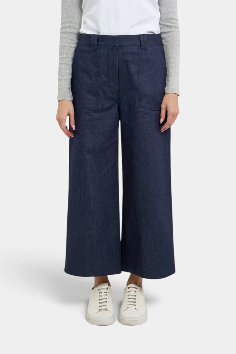The Copper Shed Gerri Pant in dark denim with wide-leg silhouette, front pockets, and contrast luggage top stitching.