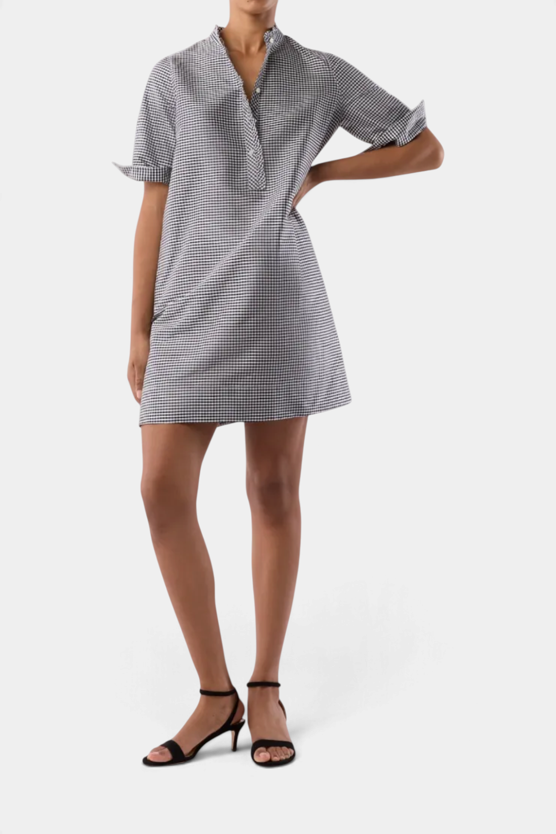 The Copper Shed gingham elbow sleeve frill dress with a popover placket and raw bias-cut trim on a model