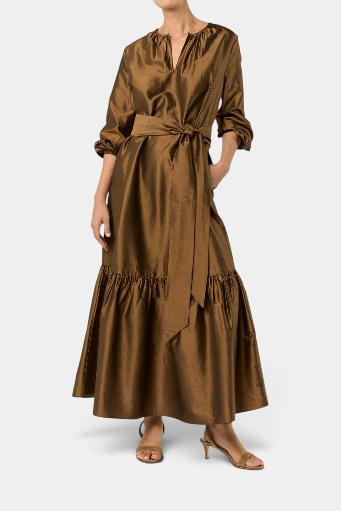 The Copper Shed gold silk shantung maxi dress with a tiered skirt, open neckline, and optional self-tie belt.