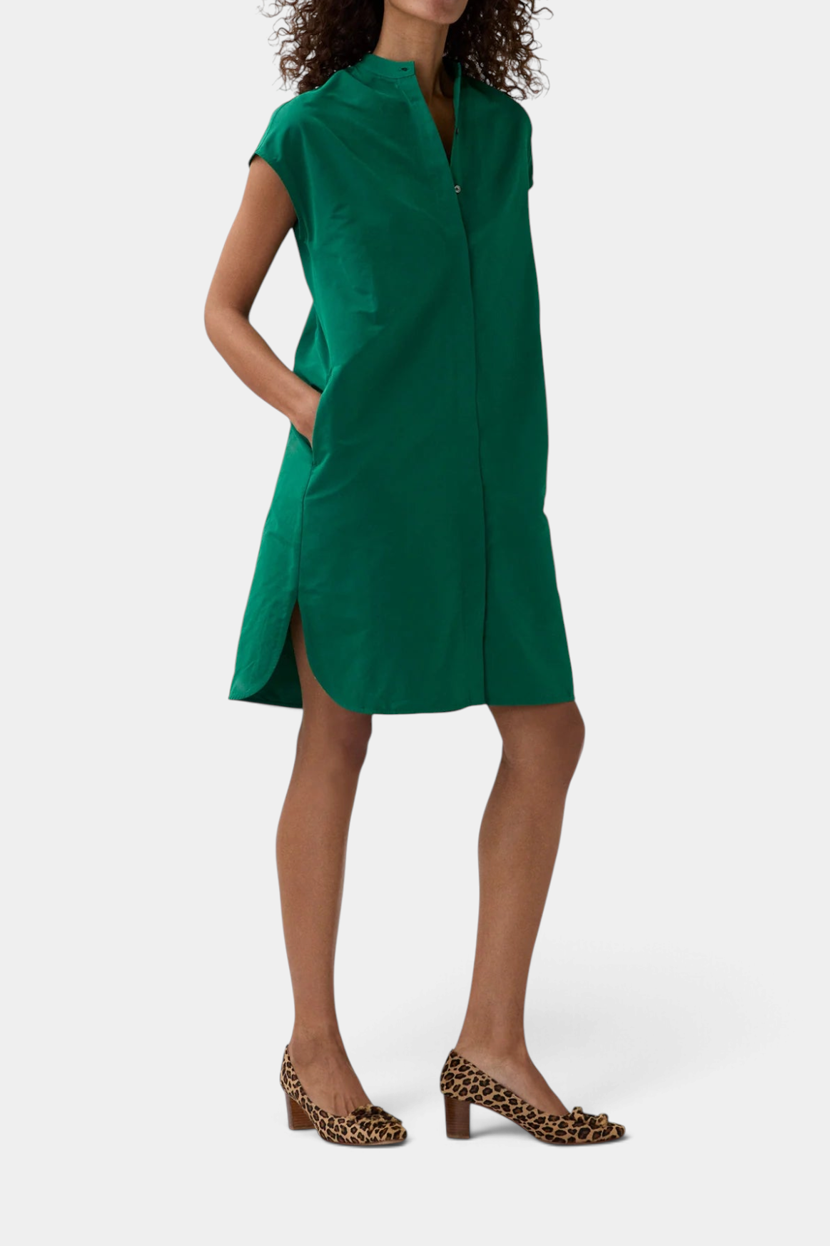 The Copper Shed green Italian faille shirtdress with cap sleeves, high-low hem, and on-seam pockets on a model.