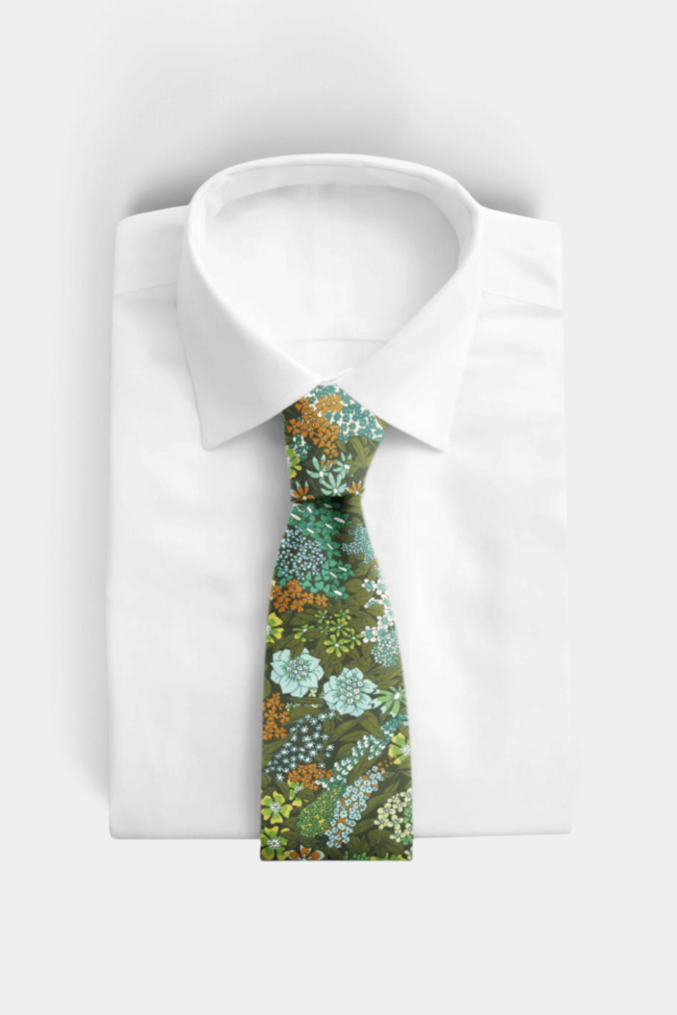 The Copper Shed Liberty of London cotton necktie featuring a green floral print, handcrafted in Vermont.