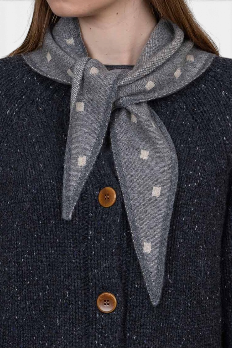 The Copper Shed Mia triangle neckerchief in grey organic cashmere with a subtle cream square pattern