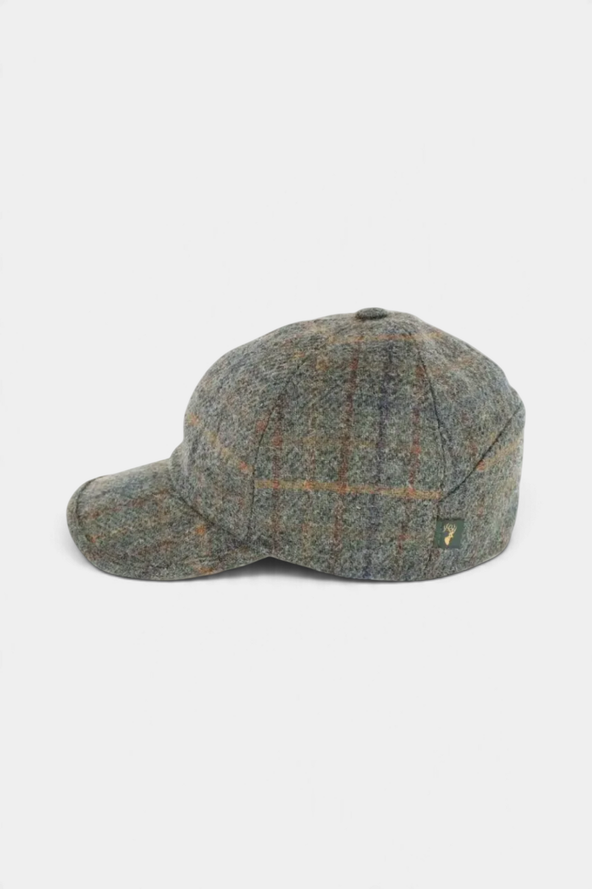 The Copper Shed grey wool baseball cap with a subtle plaid pattern and button top detail, side view.