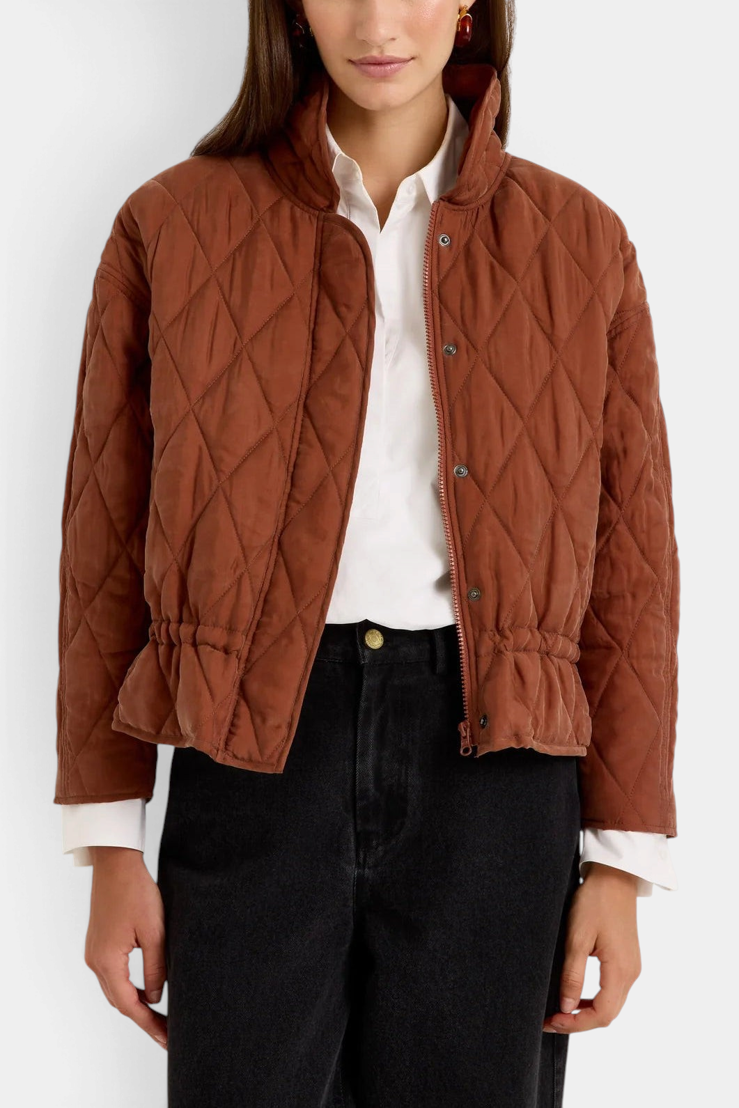 The Copper Shed Haisley quilted funnel neck jacket in tortoise brown with a drawstring waist and front zip closure.