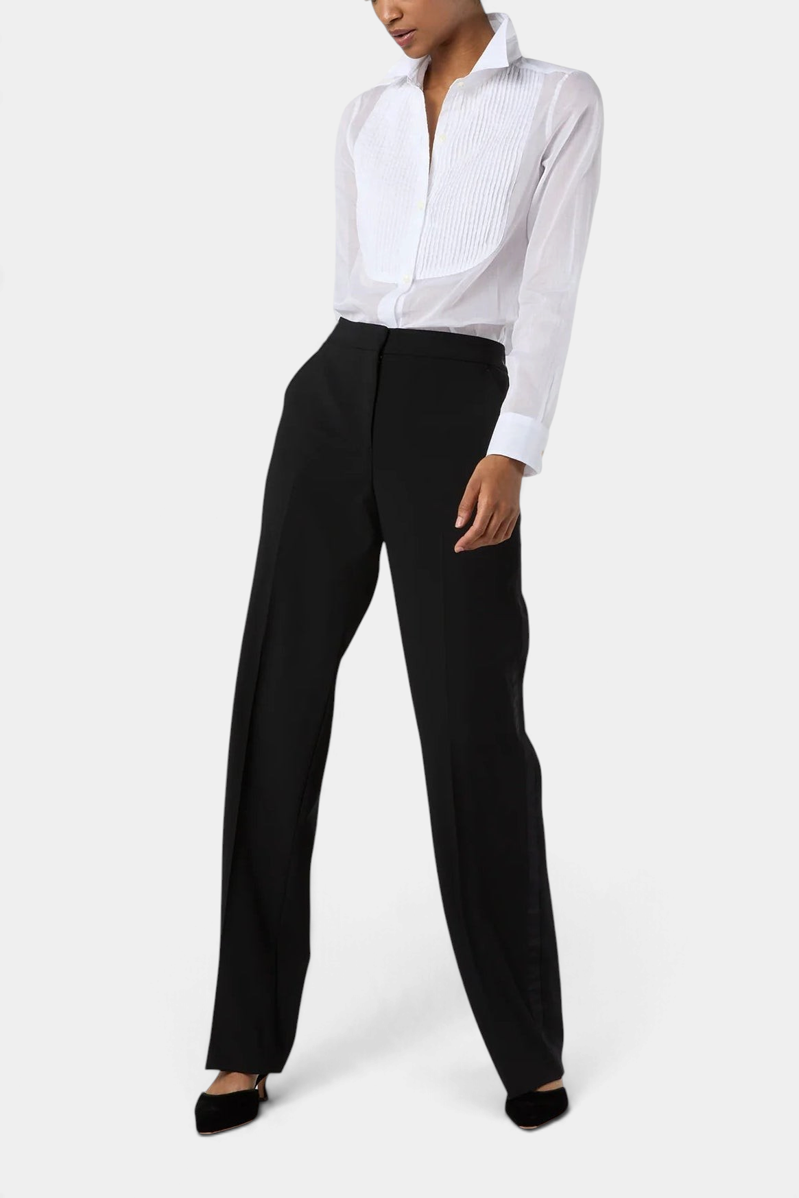 The Copper Shed Hattie shirt in white sheer cotton organdy with a pleated bib front worn with black trousers