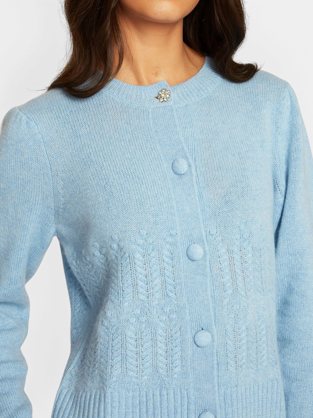 The Copper Shed heather blue cashmere cardigan with popcorn stitch, crew neck, and floral crystal button detail.