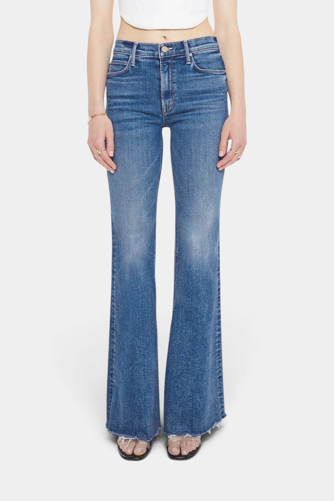 The Copper Shed The Doozy Sneak Fray high-rise flare jeans in mid-blue stretch denim with a frayed hem