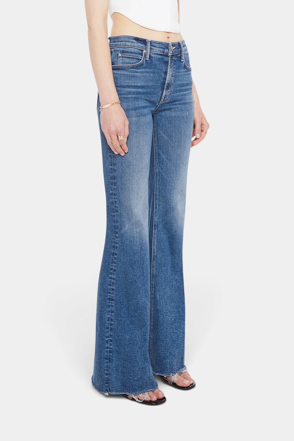 The Copper Shed The Doozy Sneak Fray high-rise flare jeans in mid-blue stretch denim with a frayed hem.