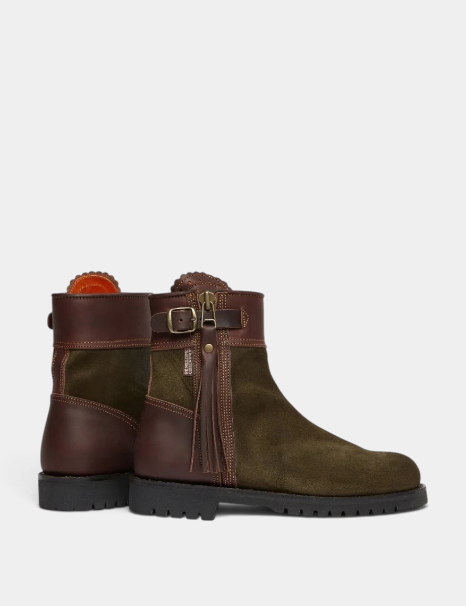 The Copper Shed Inclement cropped waterproof suede boots in olive green and brown with side tassel and buckle detail.