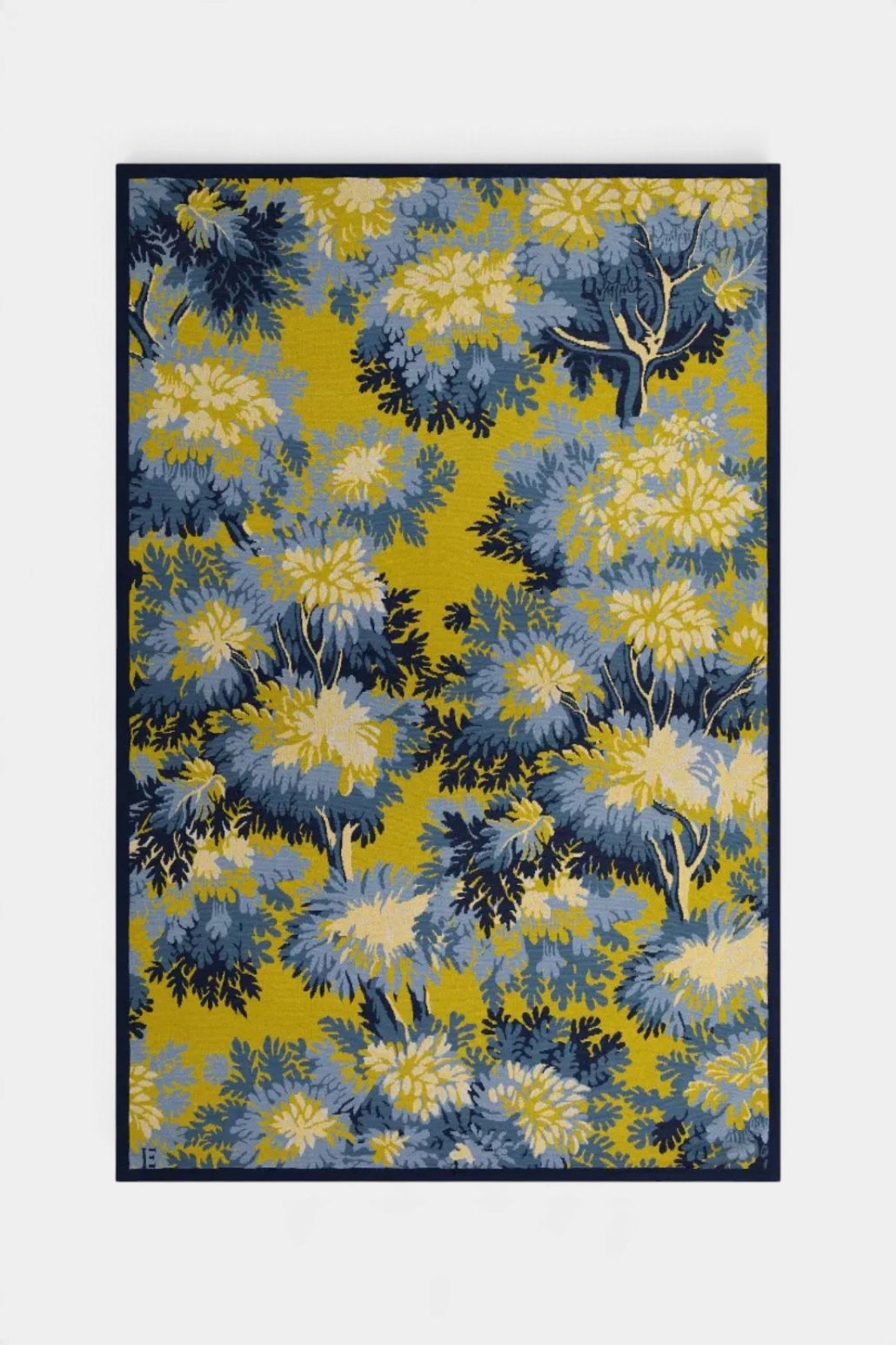 The Copper Shed Inoui Throw 130 featuring a vibrant yellow and blue floral botanical pattern on soft cotton fabric.