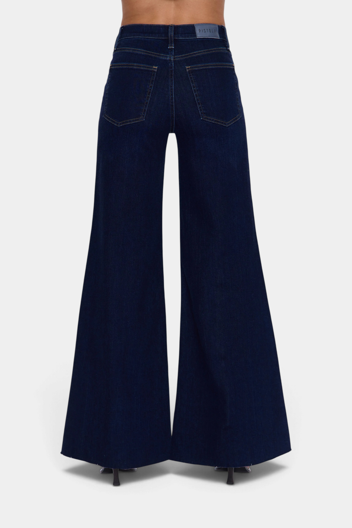 The Copper Shed Pistola Izzy high rise wide leg jeans in dark blue denim, back view showing pockets and silhouette.
