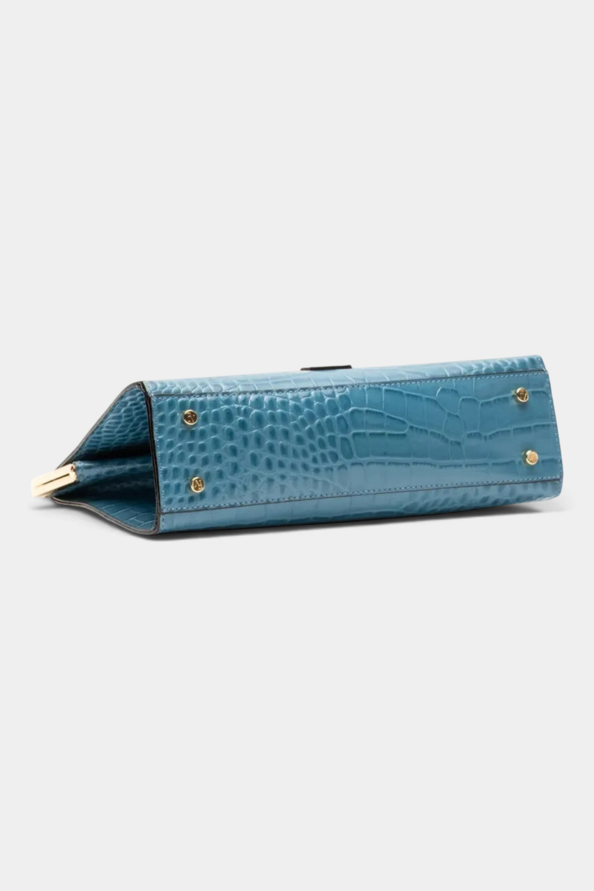 The Copper Shed Jackie Frame bag in blue croc-embossed leather, showing the bottom view with protective metal feet.