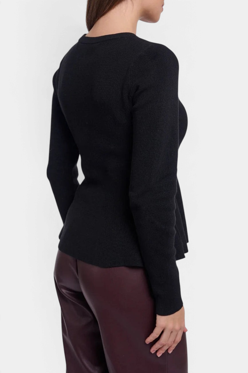 The Copper Shed Jelilah black viscose-blend knit pullover with a fitted bodice and flared peplum hem, back view.