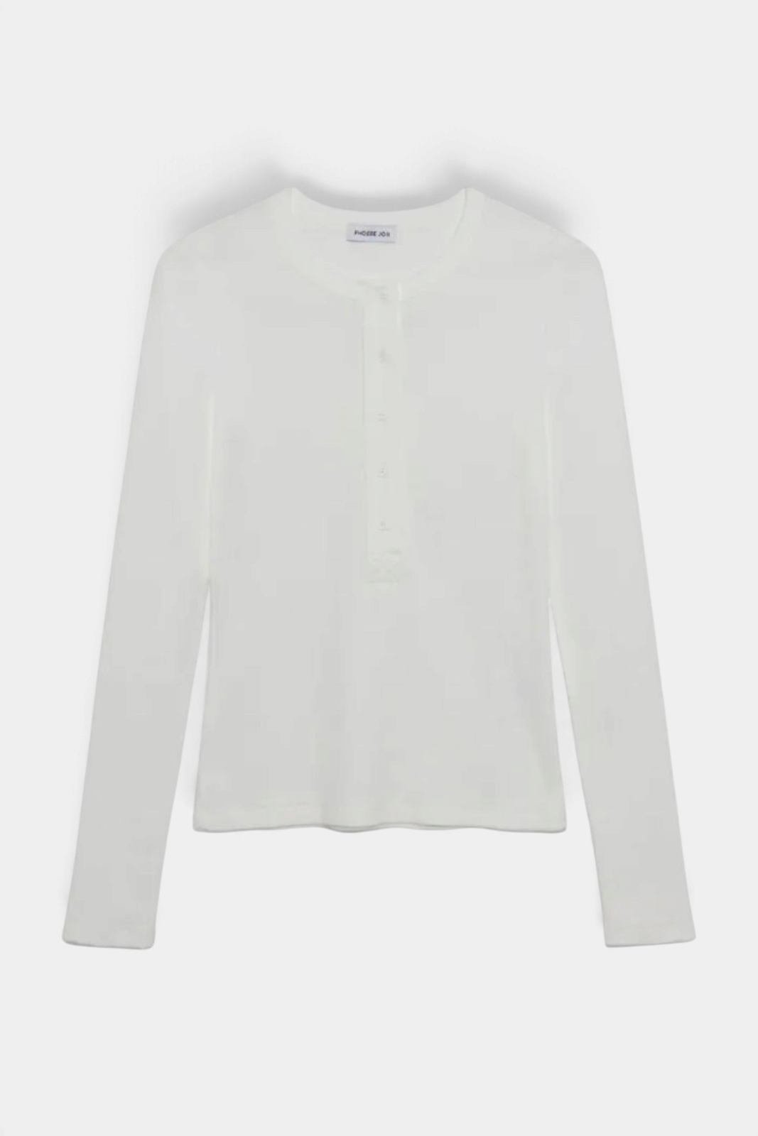 The Copper Shed Kaia long sleeve white henley tee in ribbed cotton jersey with a five-button placket.