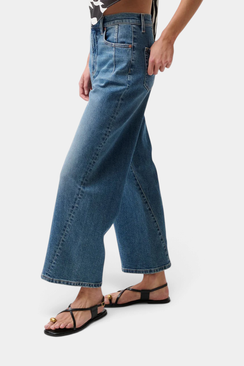 The Copper Shed Kyra high rise bowed ankle jeans in a light vintage wash with a cropped wide leg silhouette