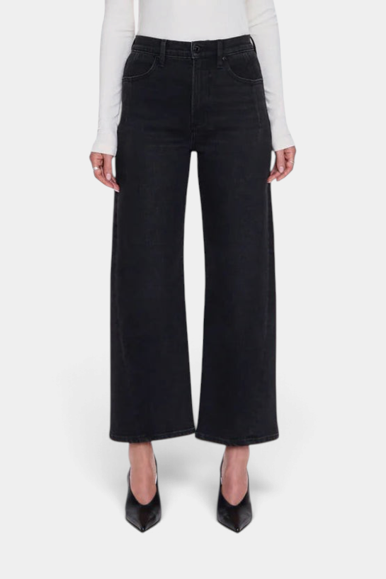 The Copper Shed Kyra high rise jeans in a black wash with a bowed leg silhouette and cropped ankle length