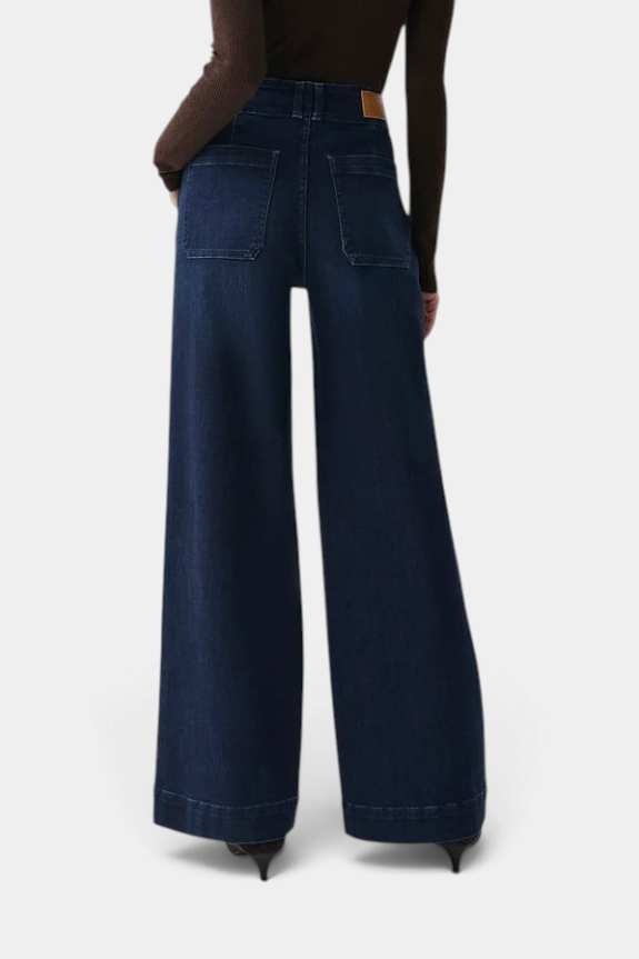 The Copper Shed Lana high-rise wide-leg jeans in a dark wash denim with back patch pockets, rear view.